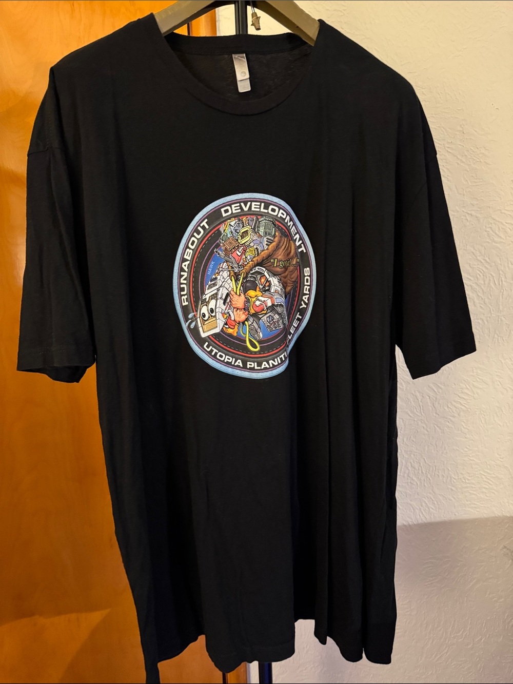 Next Level Apparel Black Short Sleeve Tee with Multicolor Circular Graphic